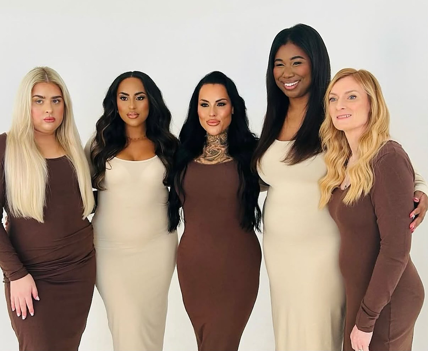 Five models showing off long, glossy House of Hair extensions in blonde, black and brunette