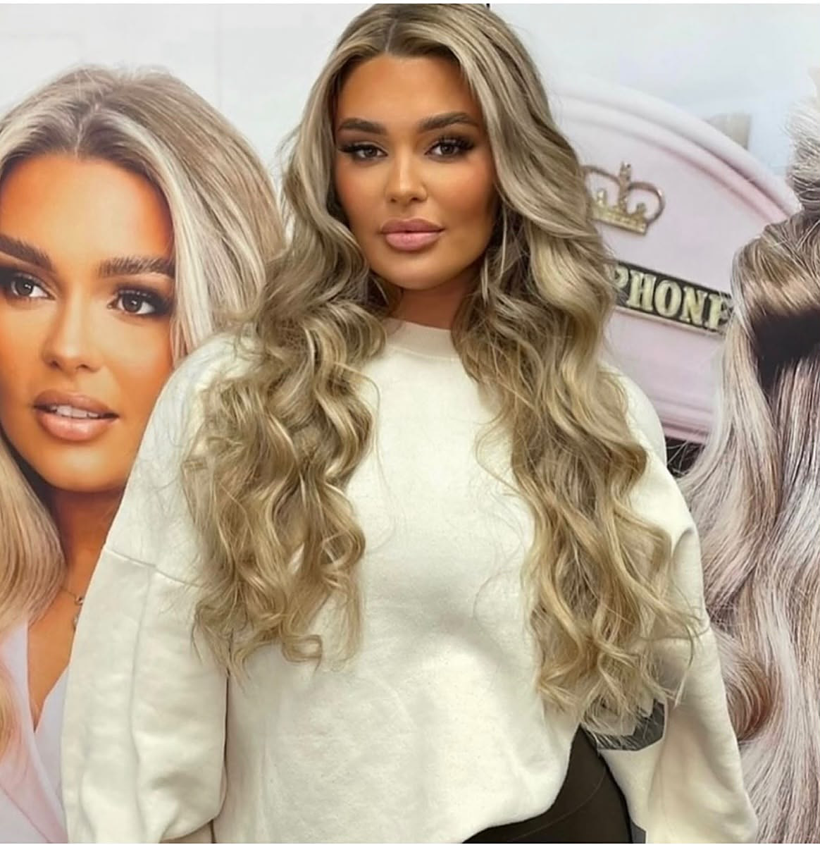 Long, voluminous blonde balayage extensions with soft curls
